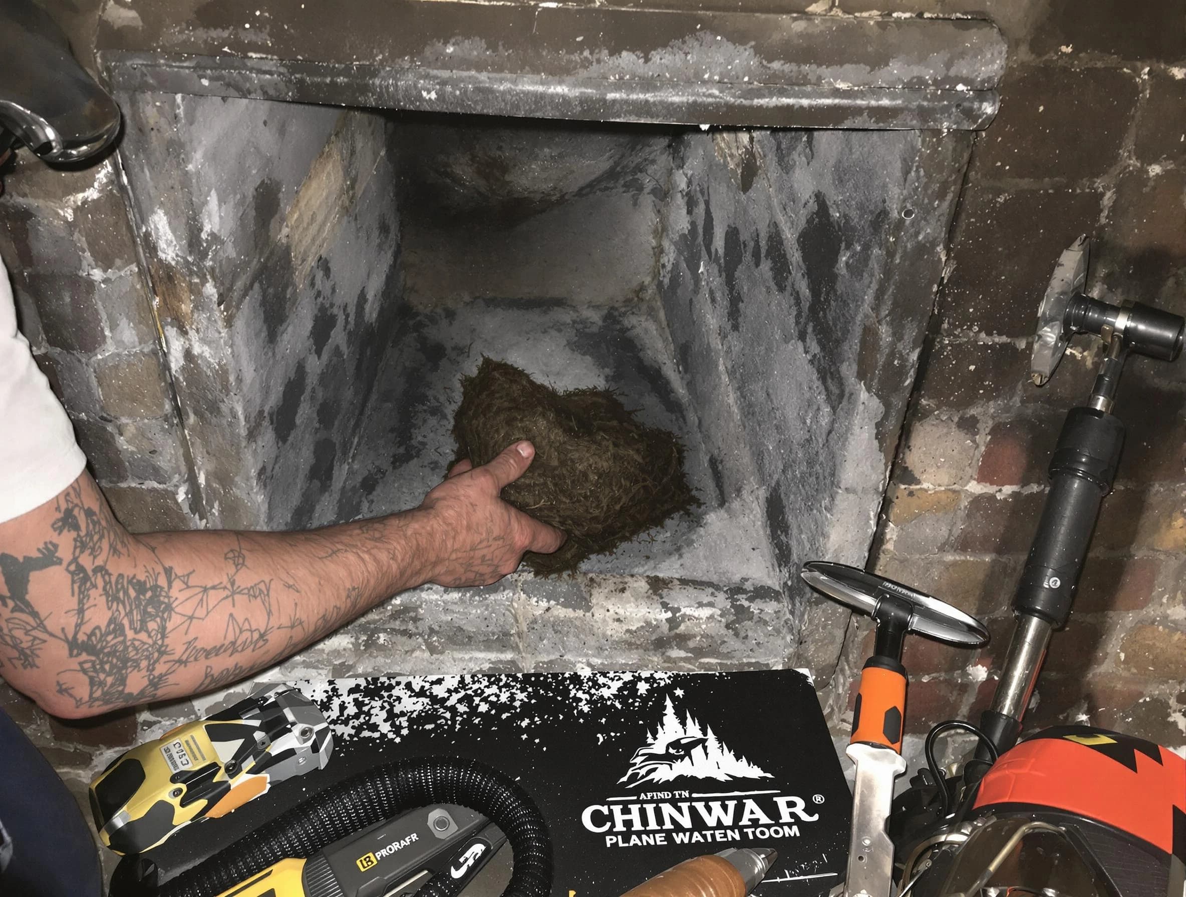 Roswell Chimney Sweep safely removing debris and screening chimney in Roswell, GA